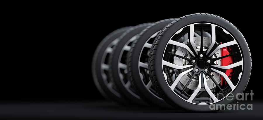Set of wheels with modern alu rims on black background #2 Photograph by Michal Bednarek