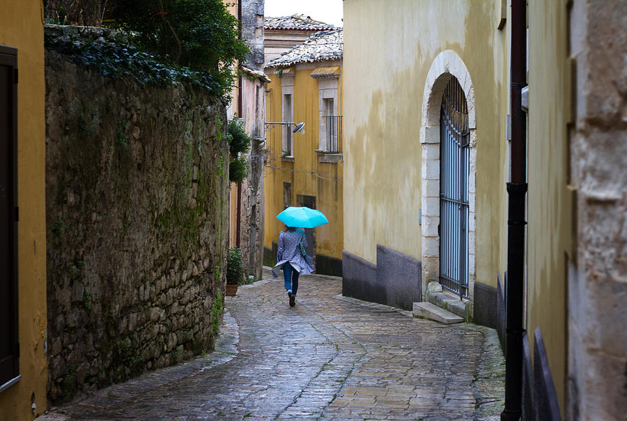 Sicily: Rainy-Windy Day in Baroque Town; Woman with Blue Umbrella #2 Photograph by JannHuizenga