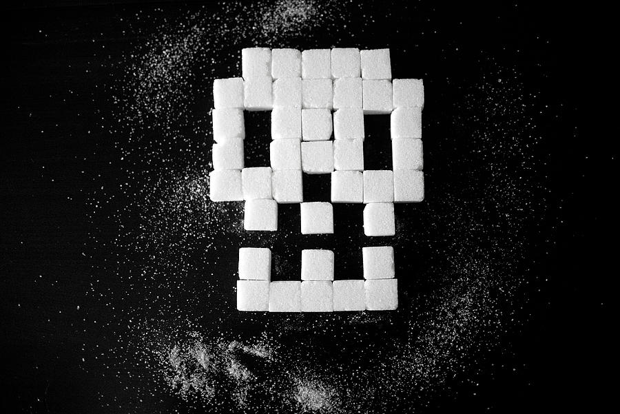 Skull made of sugar cubes, unhealthy food. #2 Photograph by Carmen Martínez Torrón