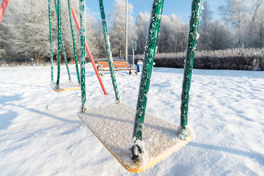 Snow Covered Swing And Slide At Playground In Winter #2 Photograph by OlgaVolodina