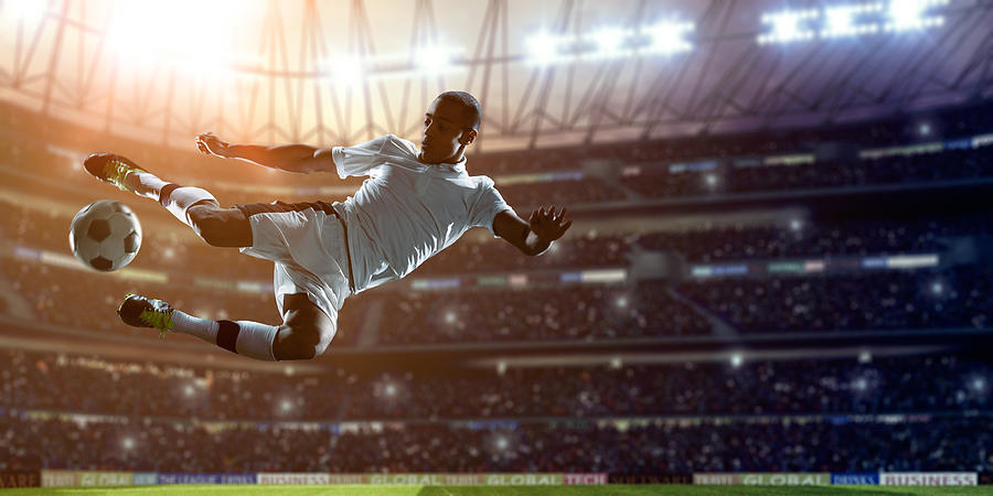 Soccer Player Kicking Ball on stadium #2 Photograph by Dmytro Aksonov