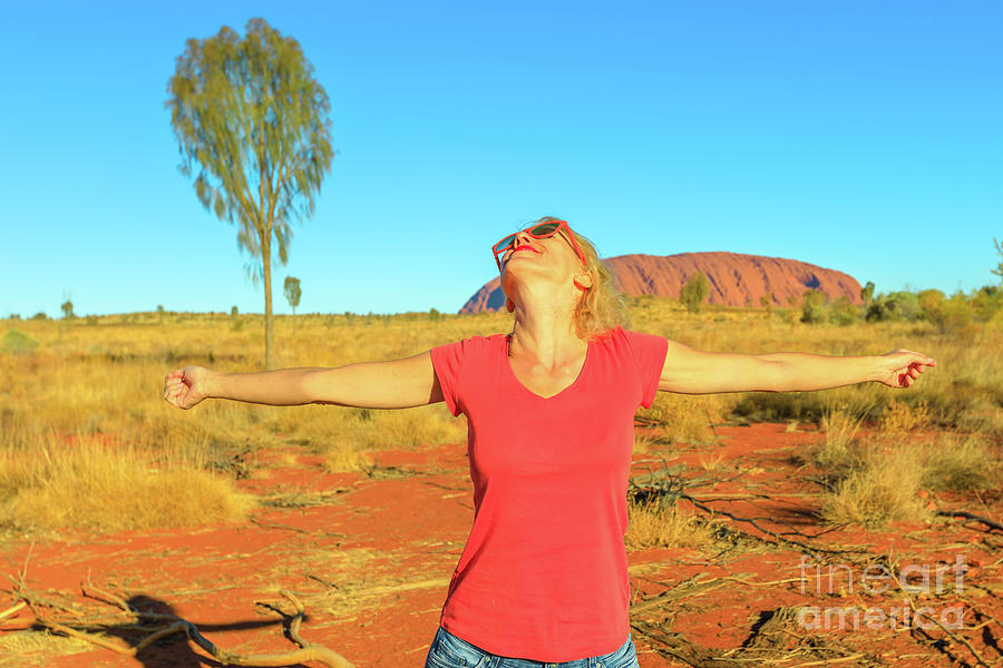 Tourist woman at Uluru #2 Photograph by Benny Marty