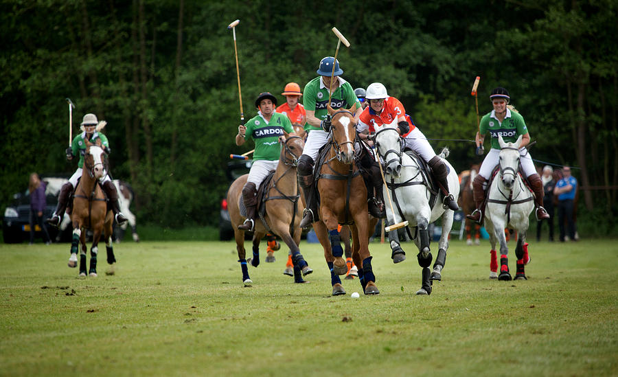 Two polo teams challenging for the ball #2 Photograph by Lorado