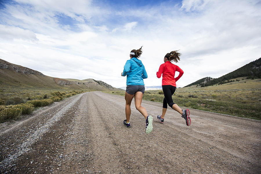 Two women running for exercise #2 Photograph by Jordan Siemens