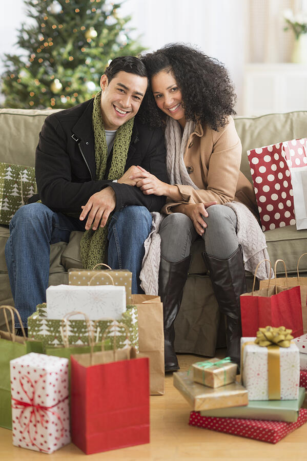 USA, New Jersey, Jersey City, Couple with Christmas presents in living room #2 Photograph by Tetra Images