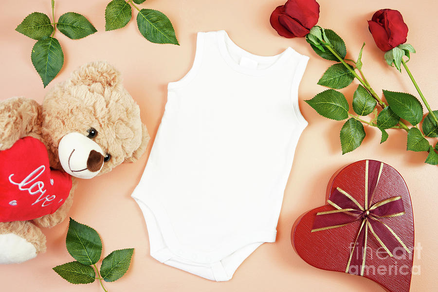 Valentine baby apparel flatlay top view on yellow table. Mock up. #2 Photograph by Milleflore Images