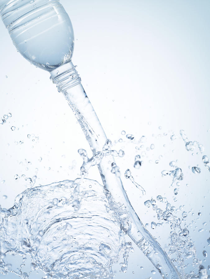 Water splashing out of bottle, close-up #2 Photograph by Yamada Taro