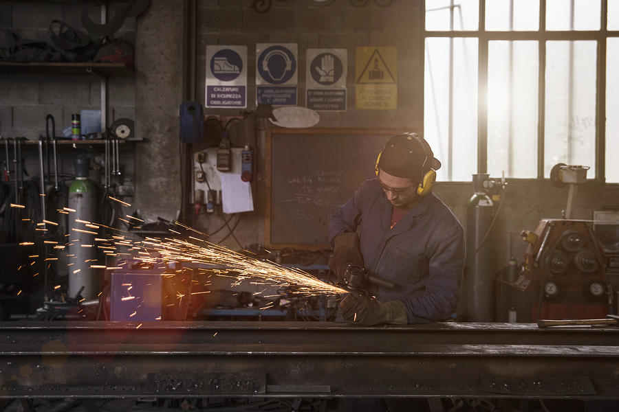 Welder cutting iron in workshop #2 Photograph by Guido Cavallini