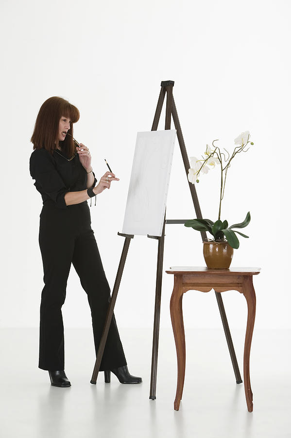 Woman painting on canvas #2 Photograph by Comstock Images