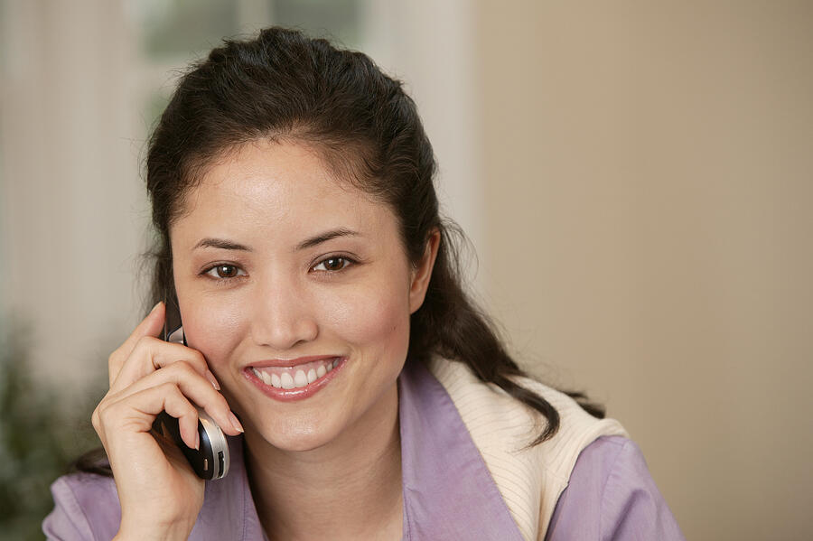Woman talking on cell phone #2 Photograph by Comstock Images