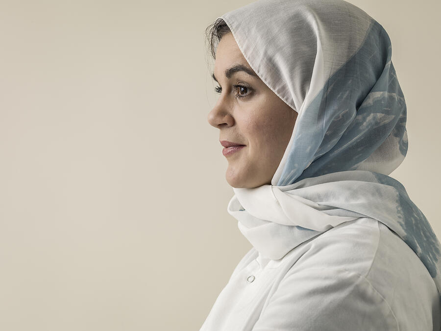 Woman wearing laboratory coat and hijab head scarf #2 Photograph by Colin Hawkins