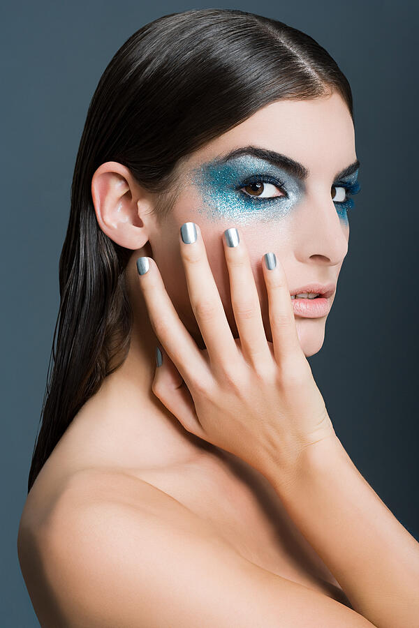 Woman with blue glitter eye makeup #2 Photograph by Image Source