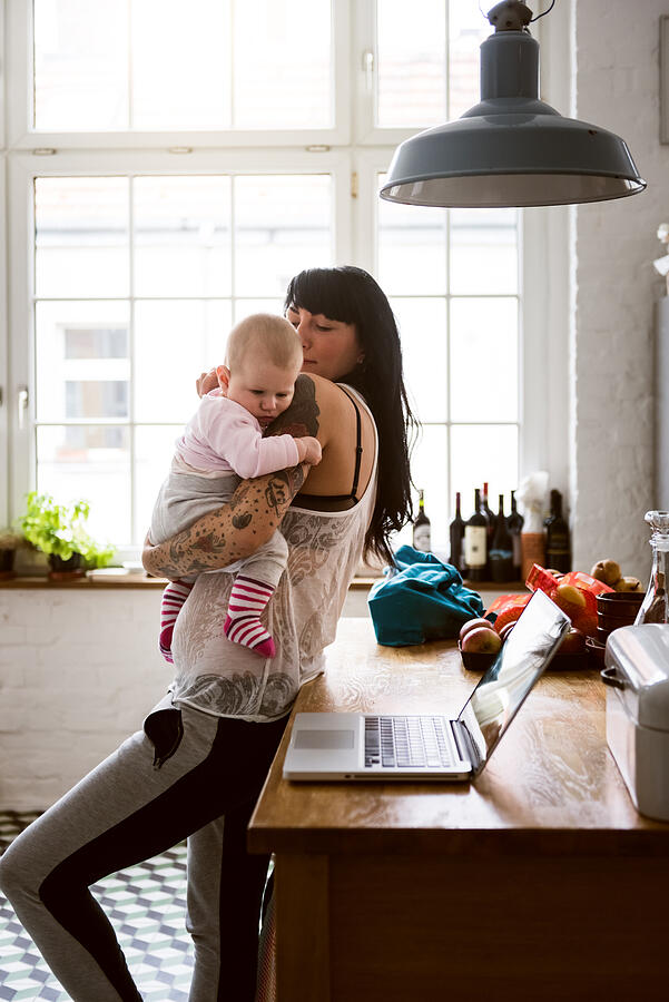 Young Tattoed Mother With Newborn Baby #2 Photograph by Hinterhaus Productions