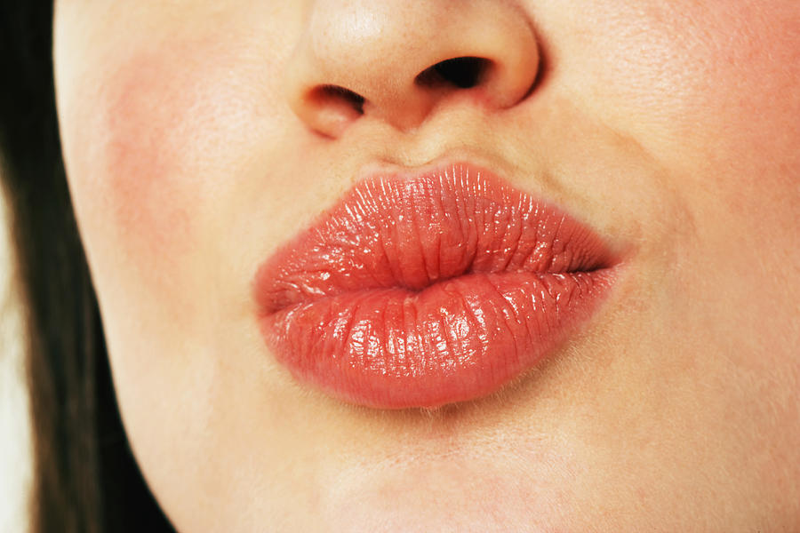 Young woman puckering lips, close-up #2 Photograph by Marili Forastieri
