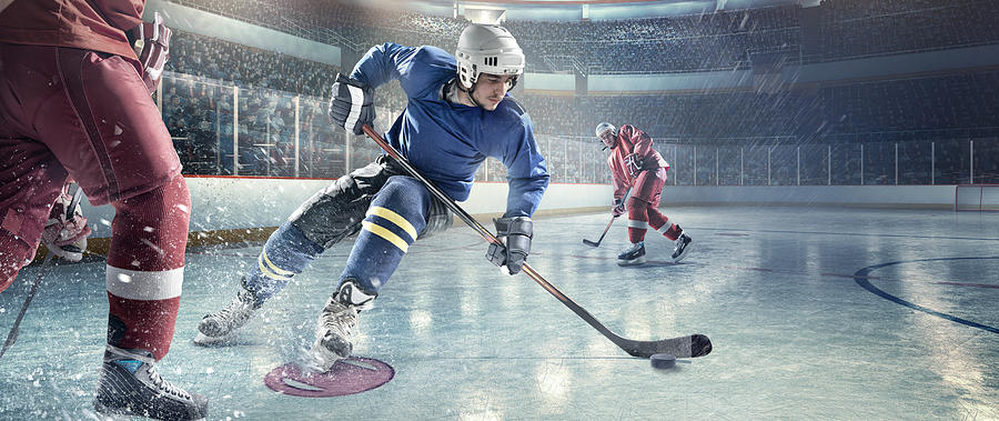 Ice hockey players in action #22 Photograph by Dmytro Aksonov