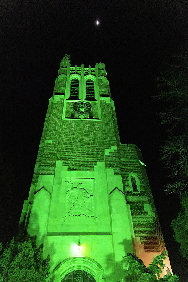 Beaumont Tower at night lit in green on the campus of Michigan State ...