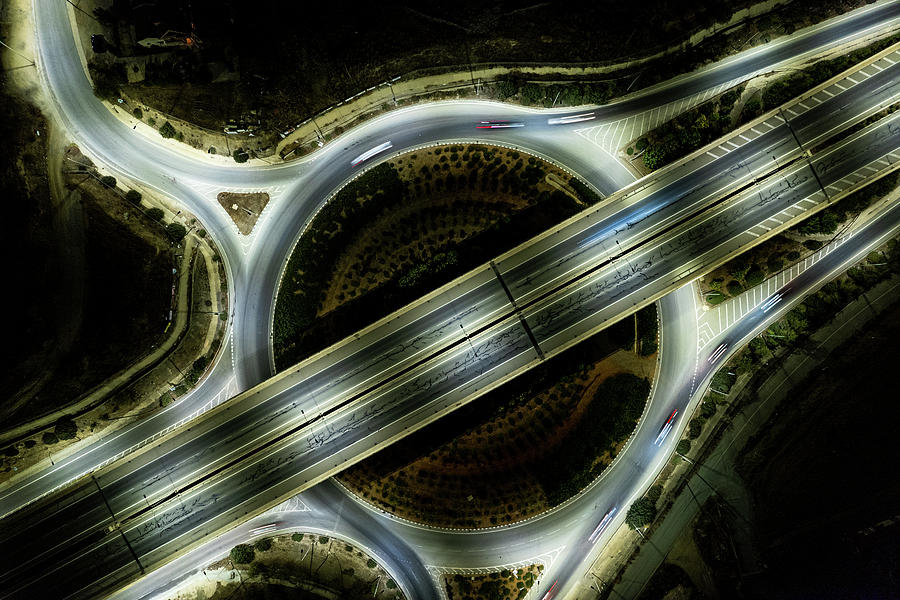 Aerial drone top view of a modern motorway junction roundabout with cars moving. Transportation infrastructure, #5 Photograph by Michalakis Ppalis