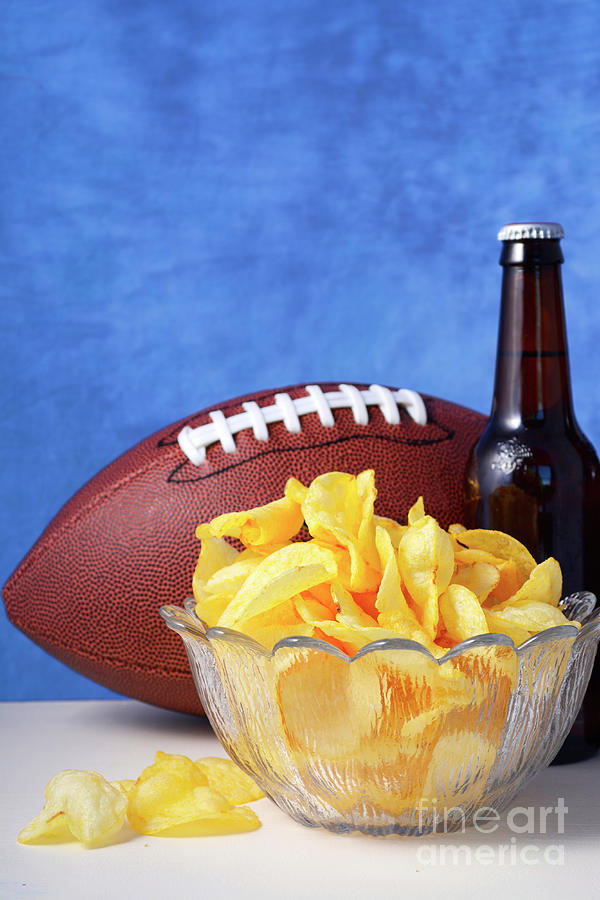 American football with beer and chips. #3 Photograph by Milleflore Images