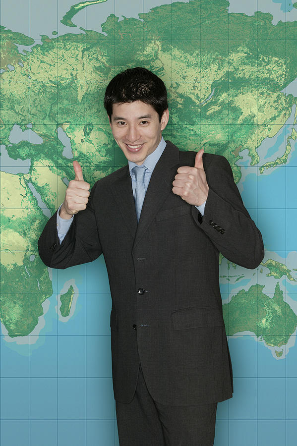 Businessman in front of world map #3 Photograph by Comstock Images