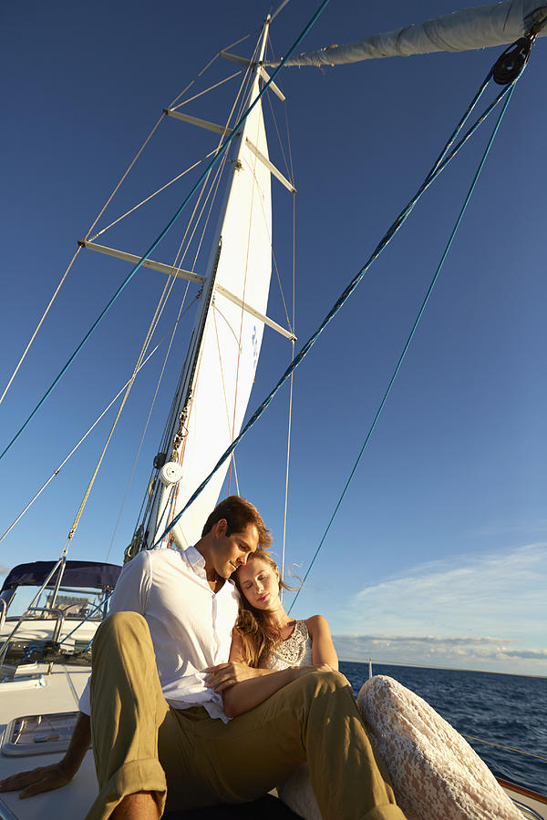 Caucasian couple sitting on yacht deck #3 Photograph by Colin Anderson Productions pty ltd