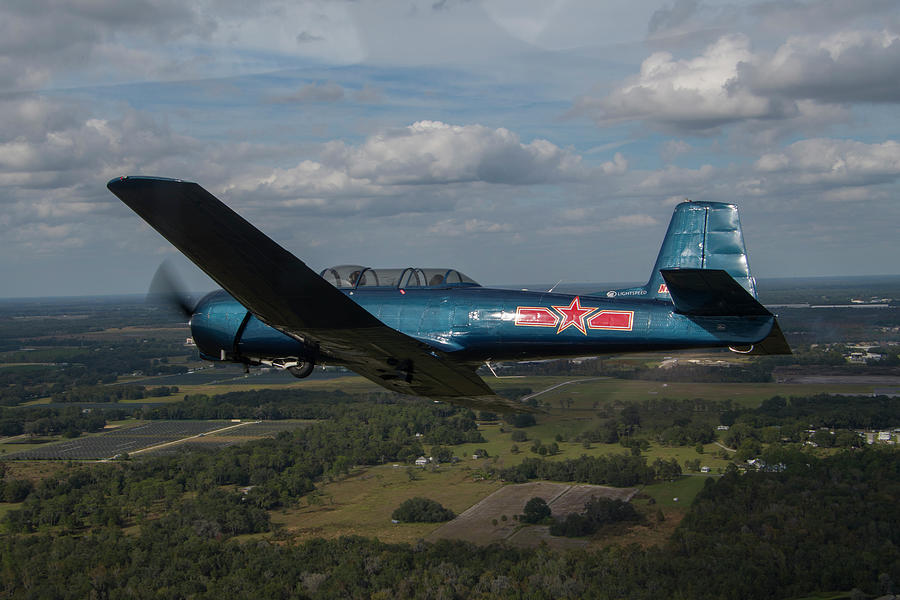 CJ6 in Flight Photograph by Carolyn Hutchins