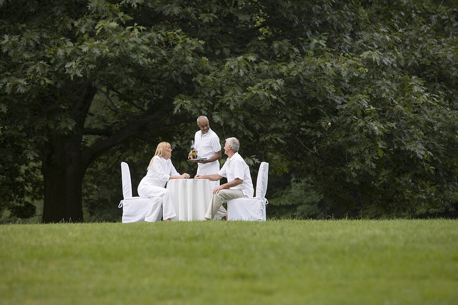Couple dining outdoors #3 Photograph by Comstock Images