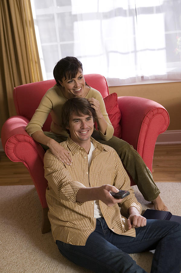 Couple watching television #3 Photograph by Comstock Images
