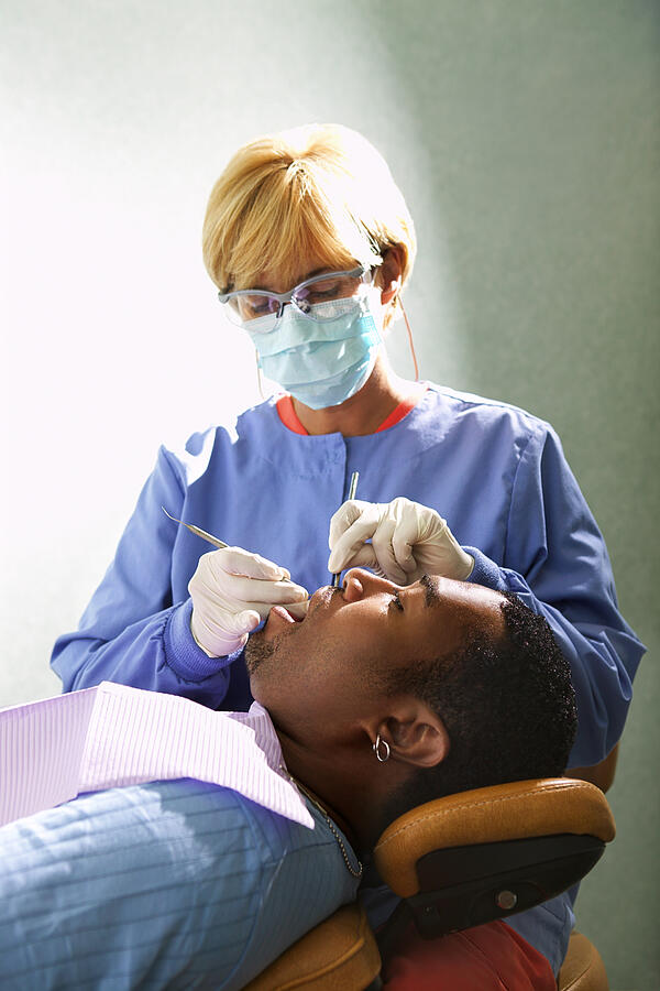 Dental hygienist with patient #3 Photograph by Thinkstock Images
