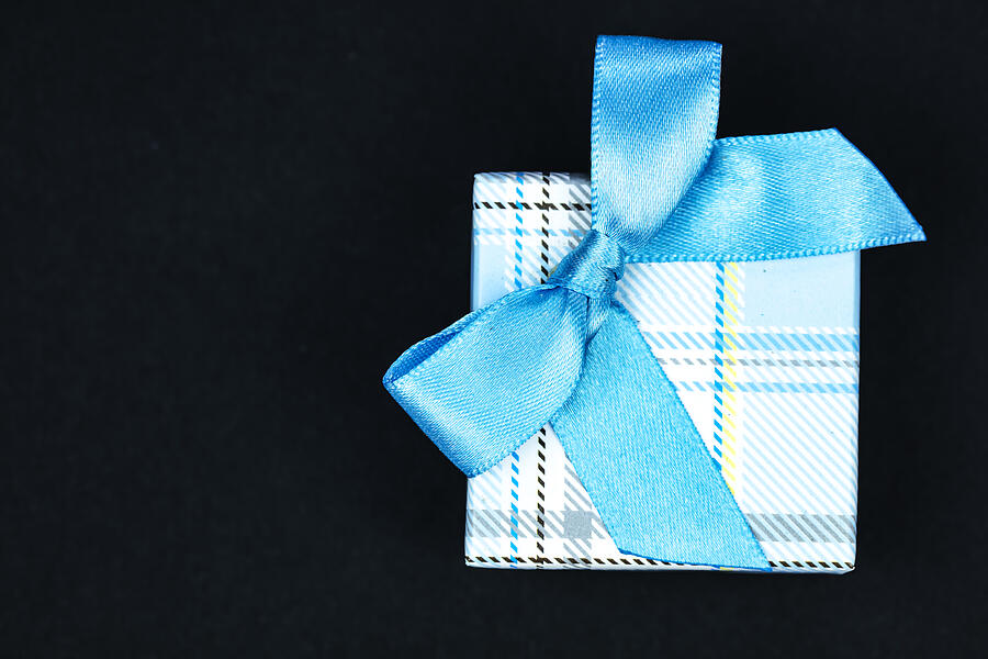 Directly Above Shot Of Gift Box With blue Ribbon on black background #3 Photograph by Mikroman6