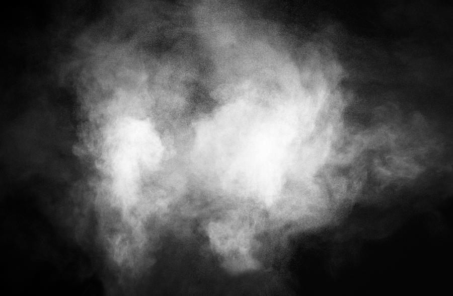 Explosion by an impact of a cloud of particles of powder and smoke of color white on a black background. #3 Photograph by Jose A. Bernat Bacete