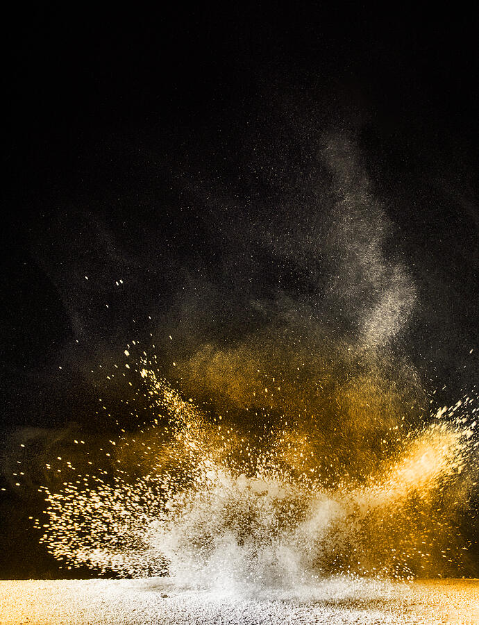 Explosion of a cloud of powder of particles of orange color on a black background #3 Photograph by Jose A. Bernat Bacete