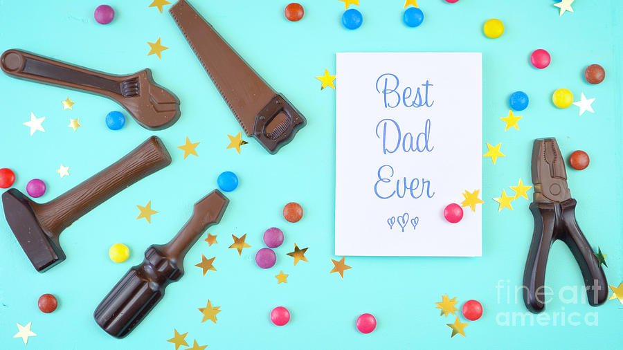 Fathers Day overhead of chocolate tool set with Best Dad Ever greeting card. #3 Photograph by Milleflore Images