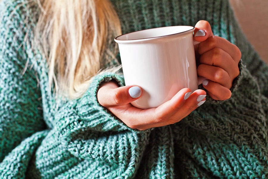 Female hands holding mug of hot tea with lemon in morning. Photograph ...