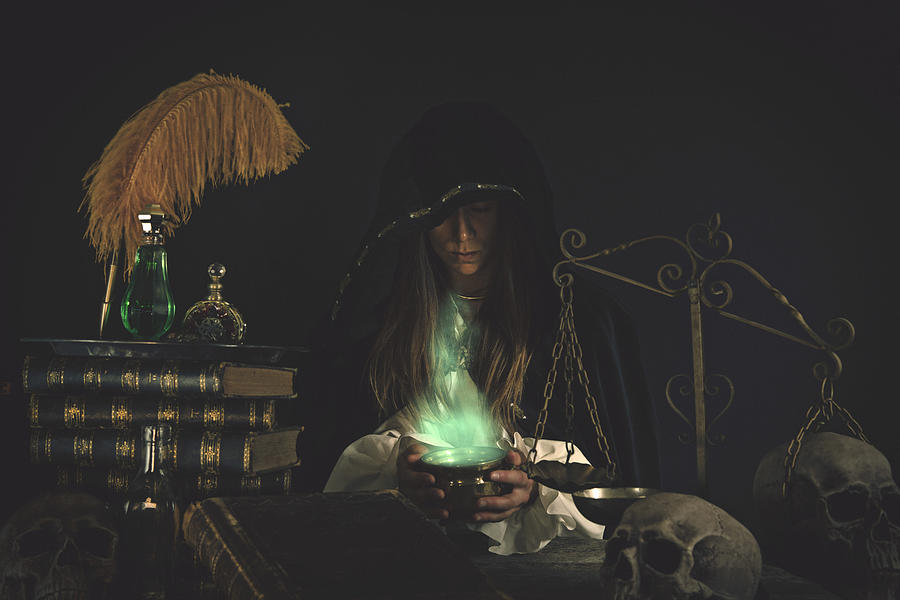 Female Wizard at table with Magical Items #3 Photograph by Powerofforever