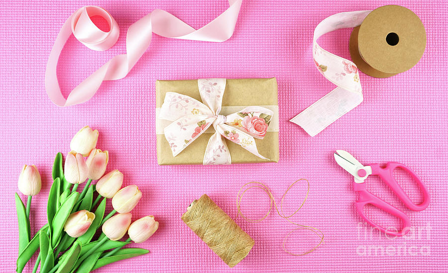 Gifts wrapped in kraft paper and pink ribbons overhead flatlay. #3 Photograph by Milleflore Images