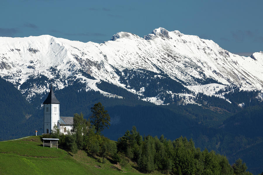 Jamnik church with Karavanke Alps backdrop #3 Photograph by Ian Middleton