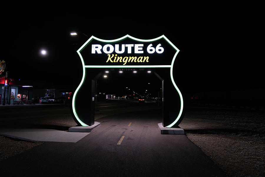 Large Route 66 sign in Kingman Arizona at night #3 Photograph by Eldon McGraw