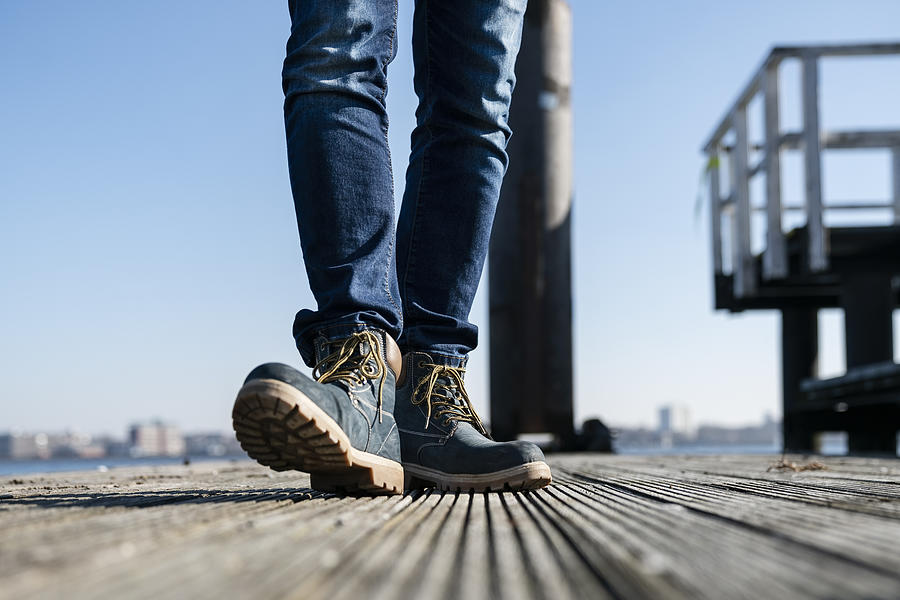 Low section of man walking on pier on sunny day in Germany. #3 Photograph by Tina Terras & Michael Walter