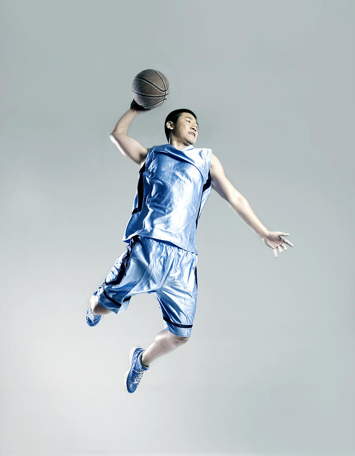Man playing basketball #3 Photograph by Ting Hoo