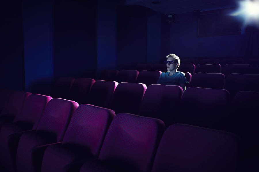 Man watching a movie in empty cinema #3 Photograph by Flashpop