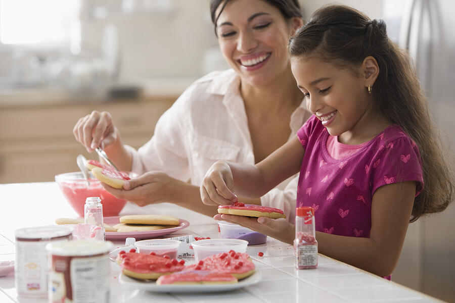 Mother and daughter making Valentines cookies #3 Photograph by Jose Luis Pelaez Inc