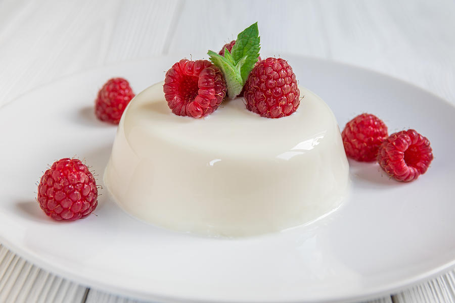 Panna cotta with raspberry, decorated with fresh mint #3 Photograph by Anton Petrus