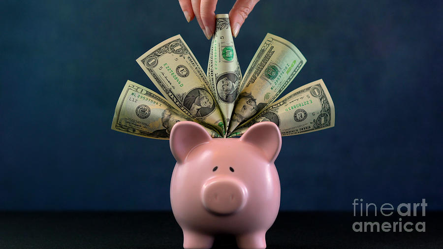 Pink Piggy bank money concept on dark blue background #3 Photograph by Milleflore Images