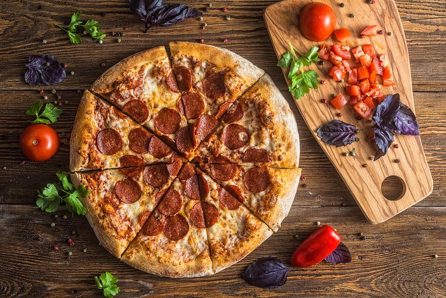 Pizza with cheese, pepperoni, chicken and pepper, a slice for a gourmet dinner #3 Photograph by Katerinasergeevna