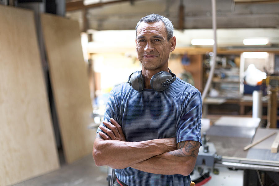 Portrait of a carpenter/builder in his workshop #3 Photograph by Jessie Casson