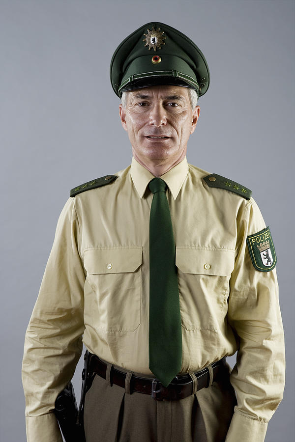 Portrait of a police officer #3 Photograph by Halfdark