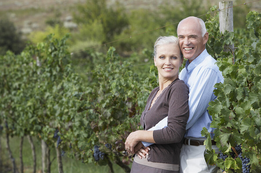 Portrait of a Senior Couple Standing in a Vineyard #3 Photograph by John Cumming