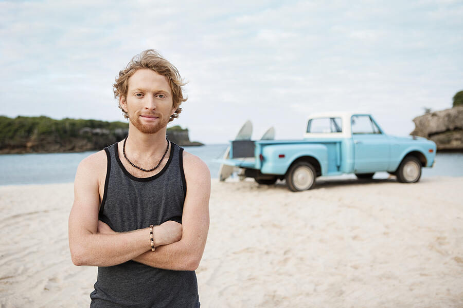 Portrait of man at beach, with pickup truck in background #3 Photograph by Felix Wirth