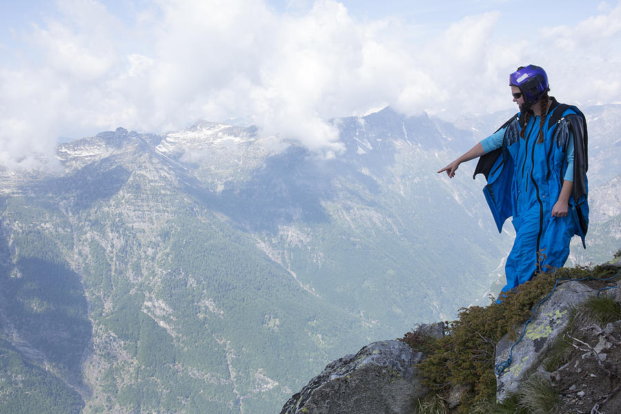 Portrait of wingsuit jumper about to launch #3 Photograph by AscentXmedia