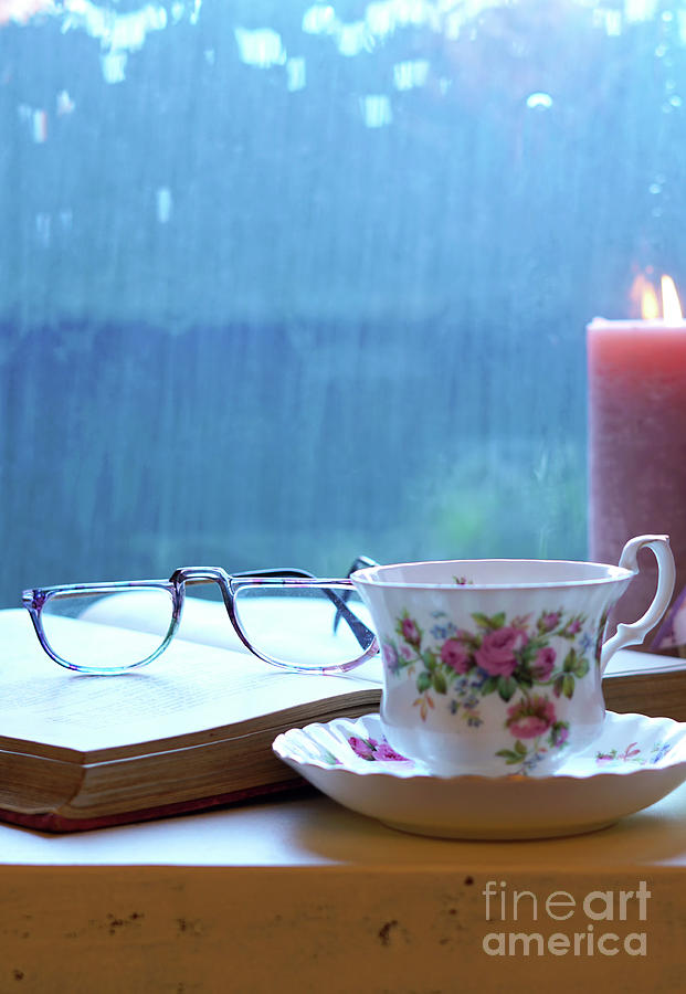Relaxing By The Window On A Cold Rainy Day With Books And Cup Of Tea Photograph By Milleflore Images